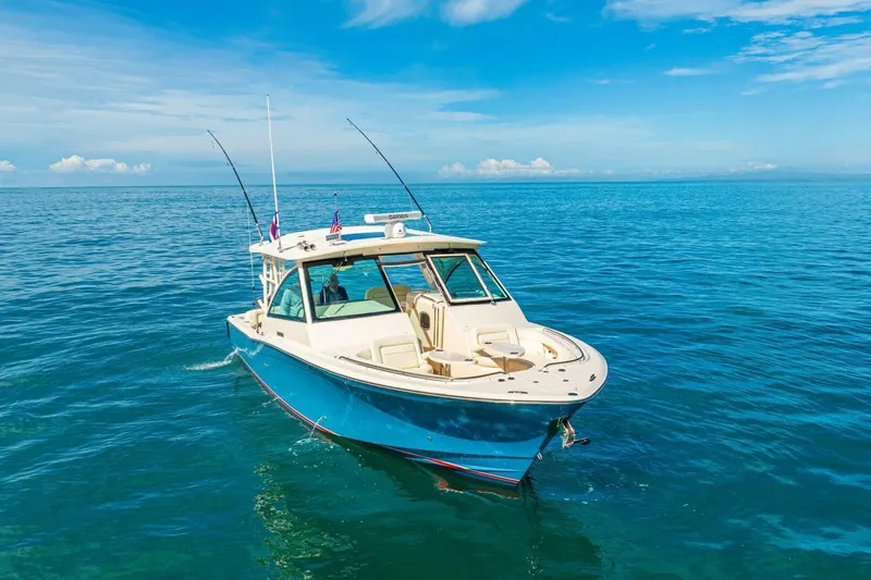 Dos Amigos Yacht Photos Pics 2020 Grady-White Freedom 375 boat cruising on clear blue ocean waters.