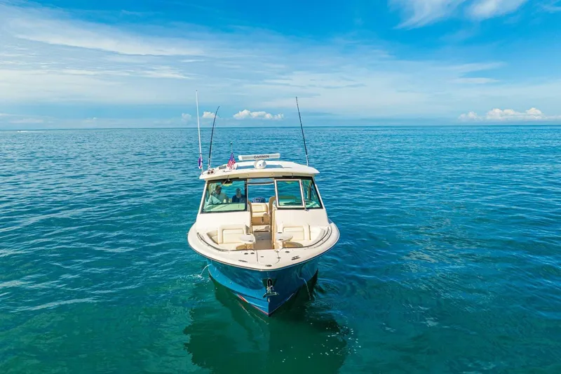 Dos Amigos Yacht Photos Pics 2020 Grady-White Freedom 375 boat on open ocean under clear blue sky.