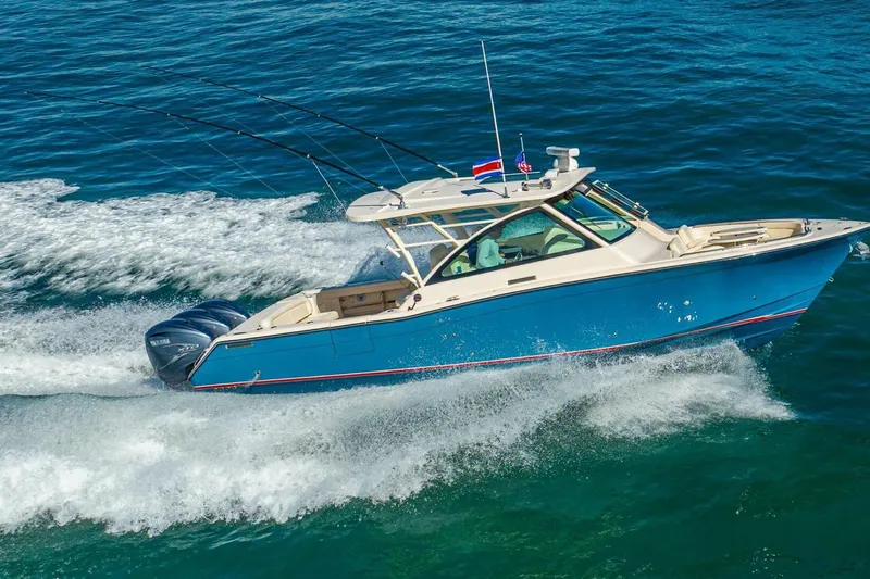 Dos Amigos Yacht Photos Pics 2020 Grady-White Freedom 375 boat cruising on open water, showcasing sleek design and powerful engines.