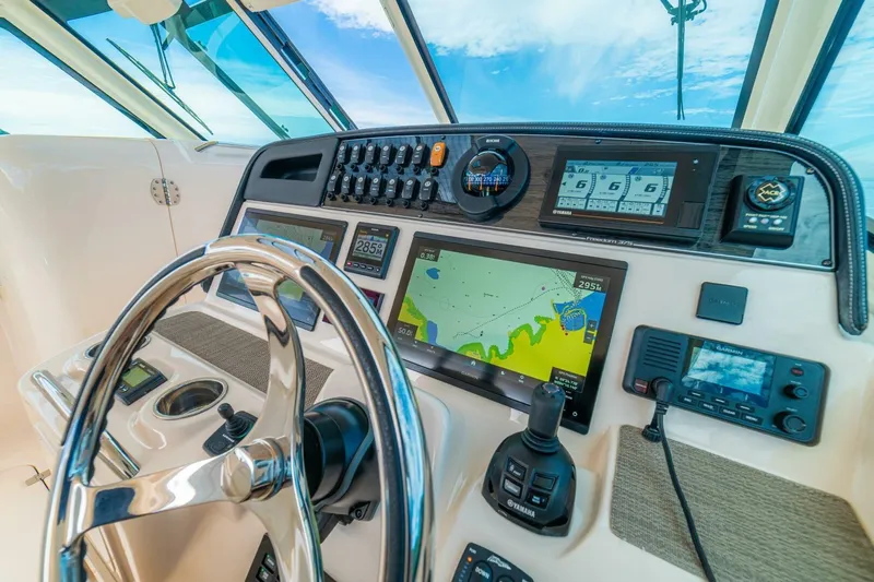 Dos Amigos Yacht Photos Pics 2020 Grady-White Freedom 375 boat dashboard with navigation and control systems.