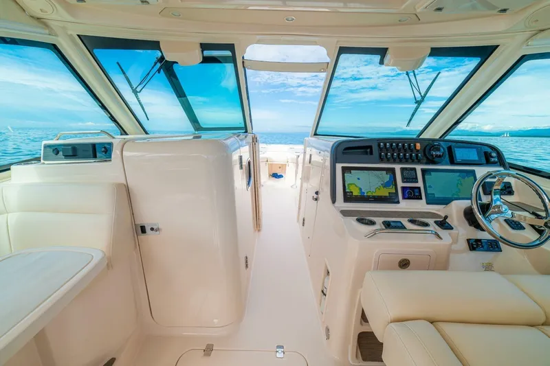 Dos Amigos Yacht Photos Pics 2020 Grady-White Freedom 375 boat interior with modern navigation system and ocean view.