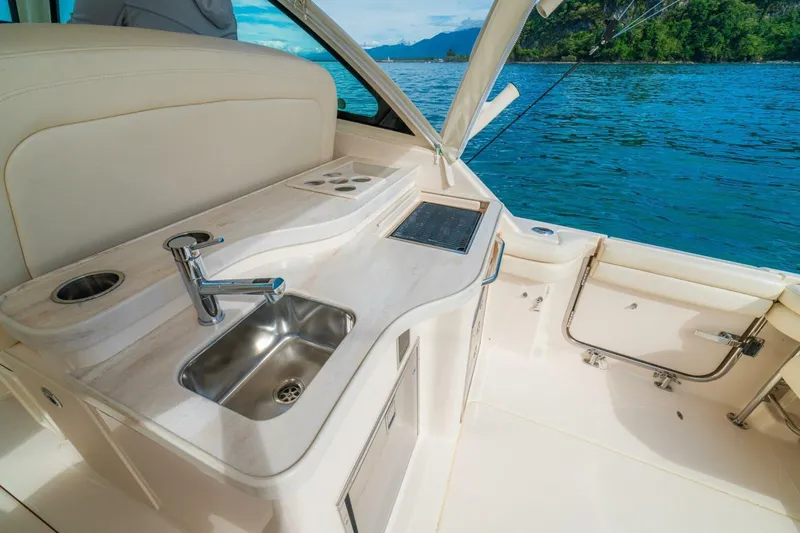 Dos Amigos Yacht Photos Pics Luxury 2020 Grady-White Freedom 375 boat interior with sink and scenic ocean view.