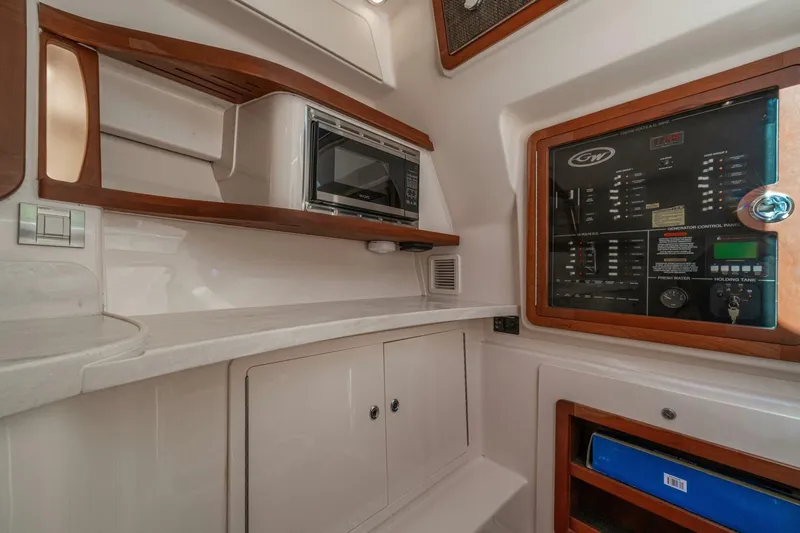 Dos Amigos Yacht Photos Pics 2020 Grady-White Freedom 375 interior with control panel and microwave.