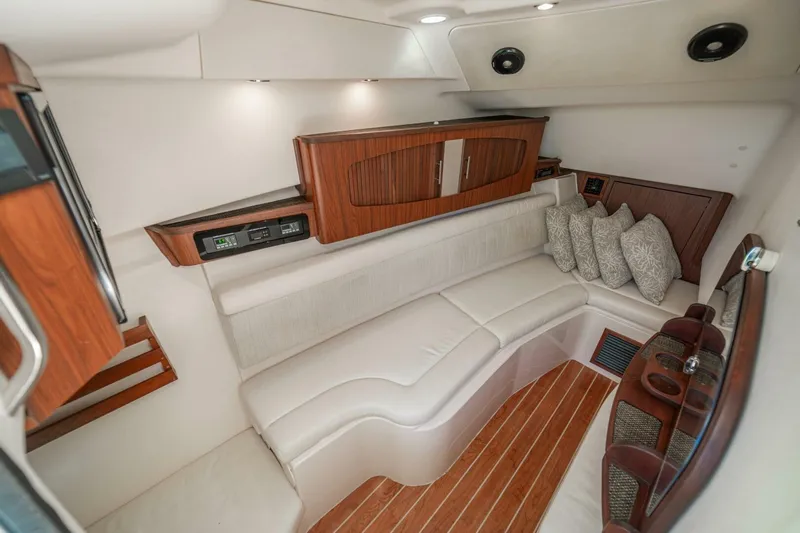 Dos Amigos Yacht Photos Pics Luxurious interior of 2020 Grady-White Freedom 375 boat with elegant seating and wood accents.