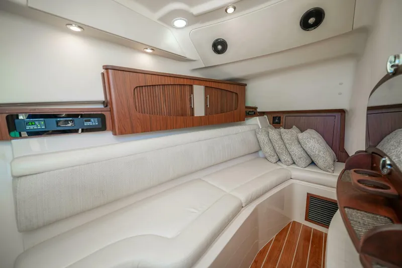 Dos Amigos Yacht Photos Pics Luxurious interior of 2020 Grady-White Freedom 375 boat with plush seating and elegant wood finishes.