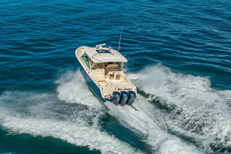 Dos Amigos Yacht Photos Pics 2020 Grady-White Freedom 375 boat cruising on open blue water.