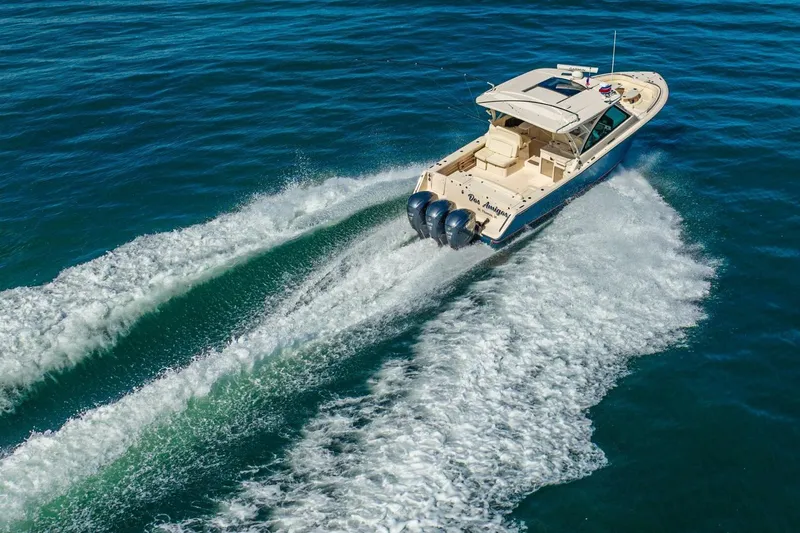 Dos Amigos Yacht Photos Pics 2020 Grady-White Freedom 375 cruising on open water, showcasing powerful triple engines.