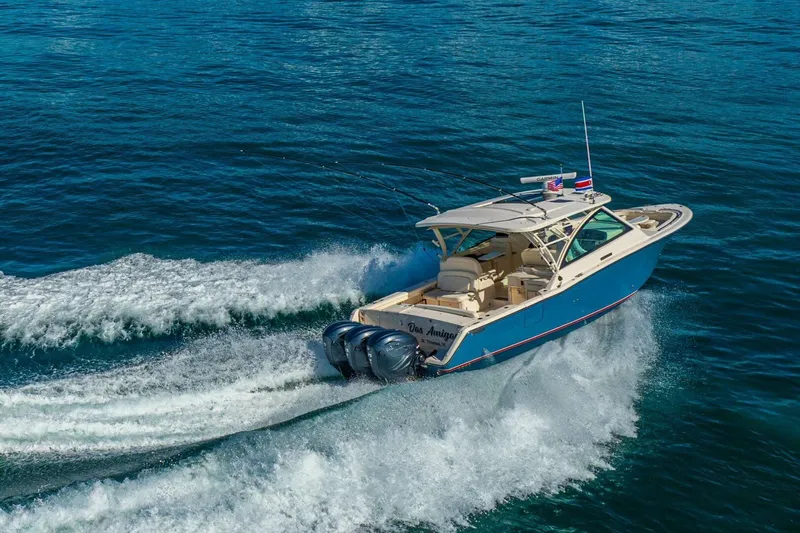 Dos Amigos Yacht Photos Pics 2020 Grady-White Freedom 375 cruising on open water, showcasing powerful dual engines.