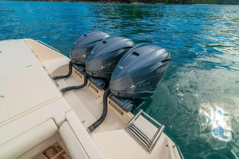 Dos Amigos Yacht Photos Pics 2020 Grady-White Freedom 375 boat with triple Yamaha outboard engines on water.