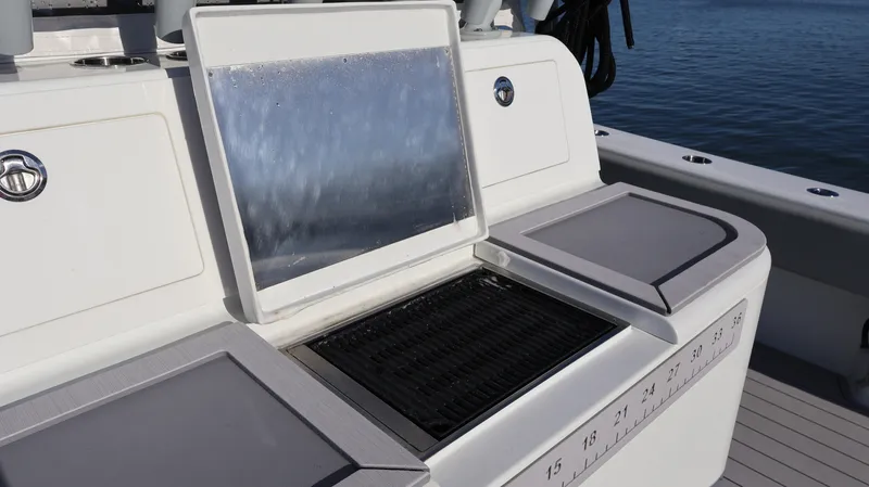 Yacht Photos Pics Freeman 47 boat grill and prep station, 2021 model, on a sunny day by the water.