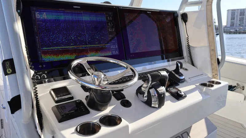  Yacht Photos Pics Control panel of a 2021 Freeman 47 boat with advanced navigation displays.
