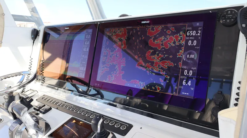  Yacht Photos Pics Control panel of a 2021 Freeman 47 boat with advanced navigation displays.
