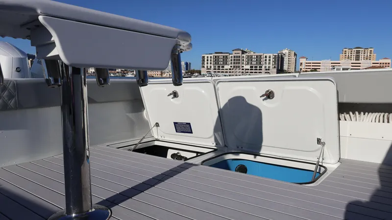  Yacht Photos Pics Freeman 47 boat deck with open storage compartments, city skyline in background, 2021 model.