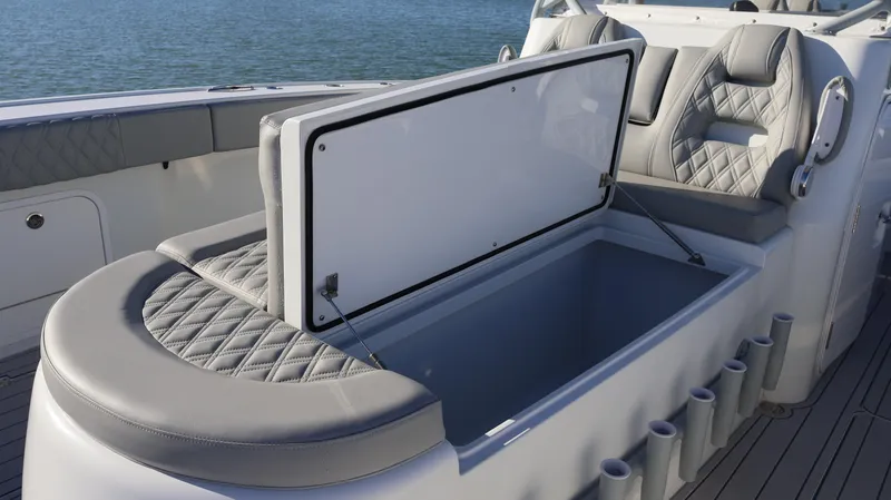  Yacht Photos Pics Freeman 47 boat seating with storage compartment, 2021 model, on calm water.