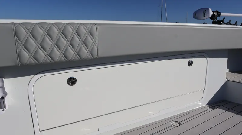  Yacht Photos Pics Freeman 47 boat interior, 2021 model, featuring quilted upholstery and storage compartment.