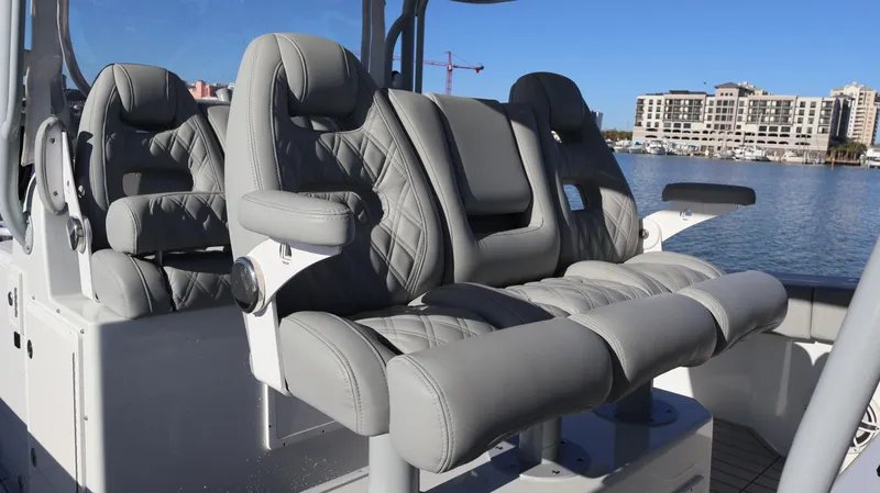 Yacht Photos Pics Luxury seating on a 2021 Freeman 47 boat, featuring gray quilted upholstery.