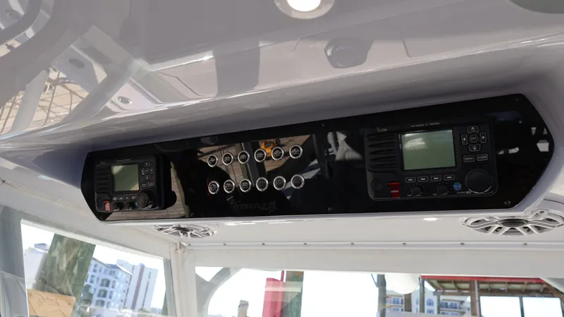  Yacht Photos Pics Control panel of a 2021 Freeman 47 boat with electronic displays and switches.