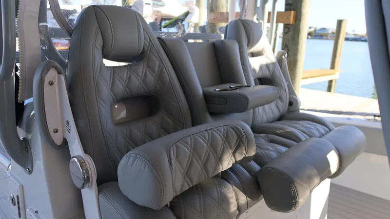  Yacht Photos Pics Luxurious leather seating on a 2021 Freeman 47 boat, featuring diamond stitching and armrests.