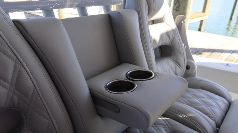  Yacht Photos Pics Luxurious Freeman 47 boat seating with cup holders, 2021 model, featuring quilted leather design.