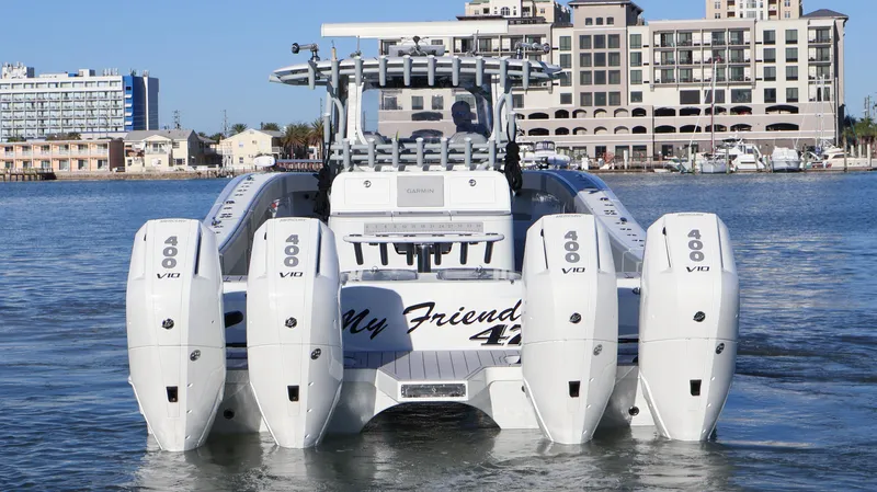  Yacht Photos Pics 2021 Freeman 47 boat with quad 400 V10 engines, docked near waterfront buildings.