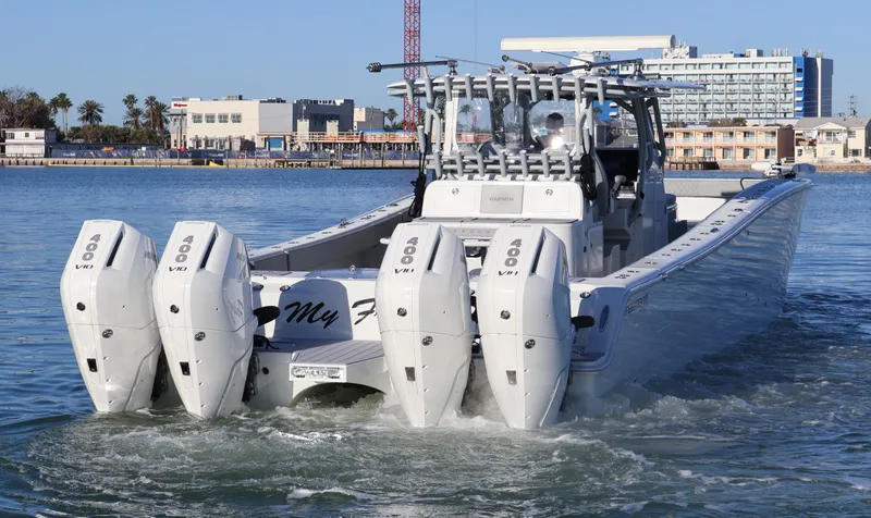  Yacht Photos Pics 2021 Freeman 47 boat with four powerful outboard engines on the water.