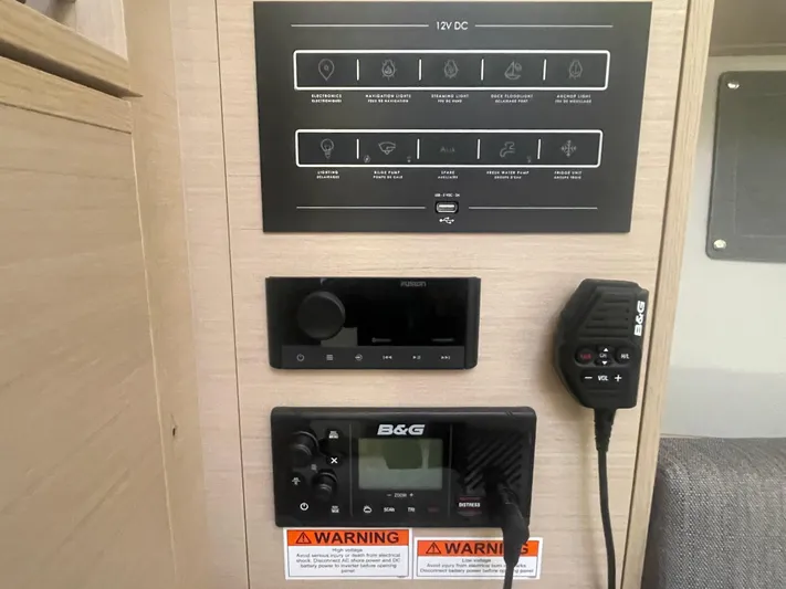 Cutting Edge Yacht Photos Pics Control panel of 2023 Beneteau Oceanis 34.1 yacht with navigation and communication equipment.