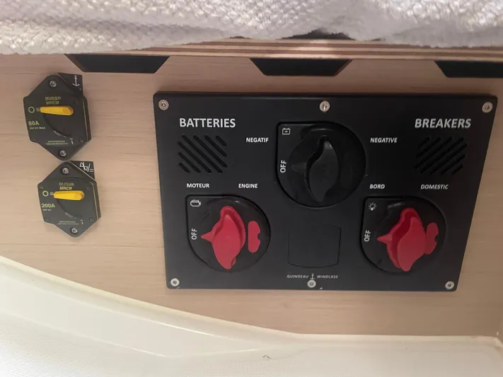 Cutting Edge Yacht Photos Pics Electrical panel on a 2023 Beneteau Oceanis 34.1 sailboat, featuring battery and breaker controls.
