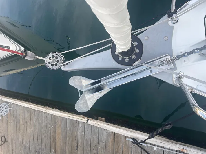 Cutting Edge Yacht Photos Pics Bow of 2023 Beneteau Oceanis 34.1 sailboat with anchor and dock view.