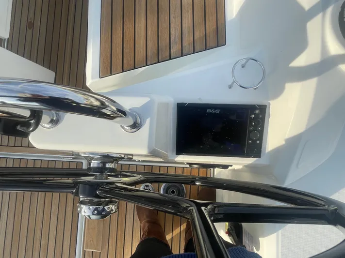 Cutting Edge Yacht Photos Pics 2023 Beneteau Oceanis 34.1 yacht helm with B&G navigation system and teak decking.