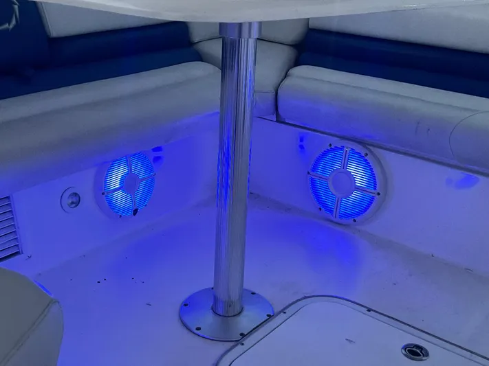  Yacht Photos Pics 2006 Fountain 48 Express Cruiser interior with blue LED lighting and cushioned seating.