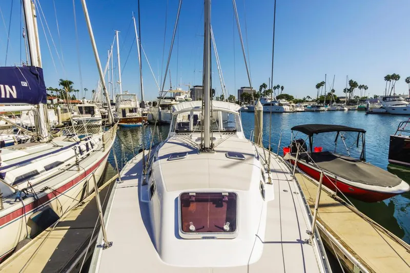 Kia Ora Yacht Photos Pics Catalina 385 sailboat docked in marina, sunny day, 2014 model.