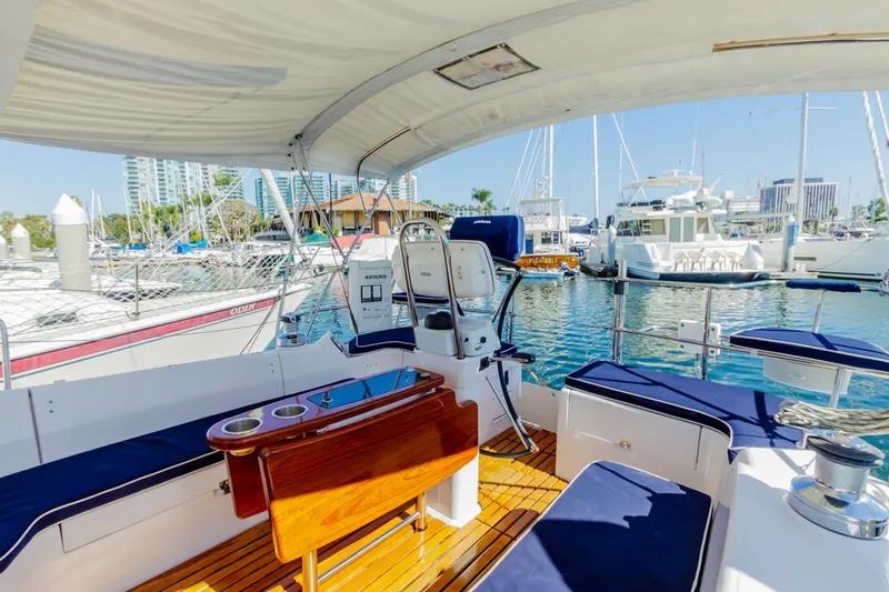 Kia Ora Yacht Photos Pics 2014 Catalina 385 yacht interior with seating, docked in a marina.