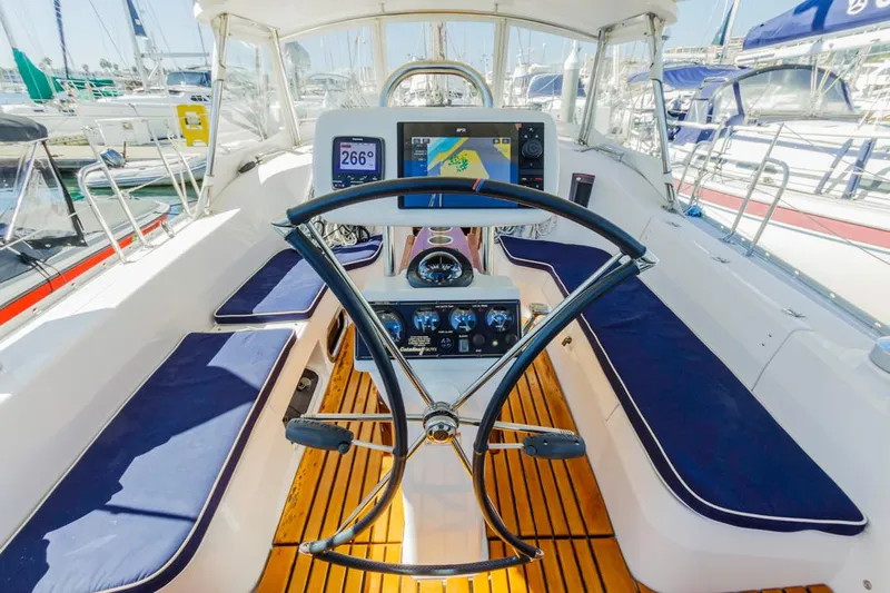 Kia Ora Yacht Photos Pics Catalina 385 sailboat cockpit, 2014 model, featuring navigation equipment and seating.