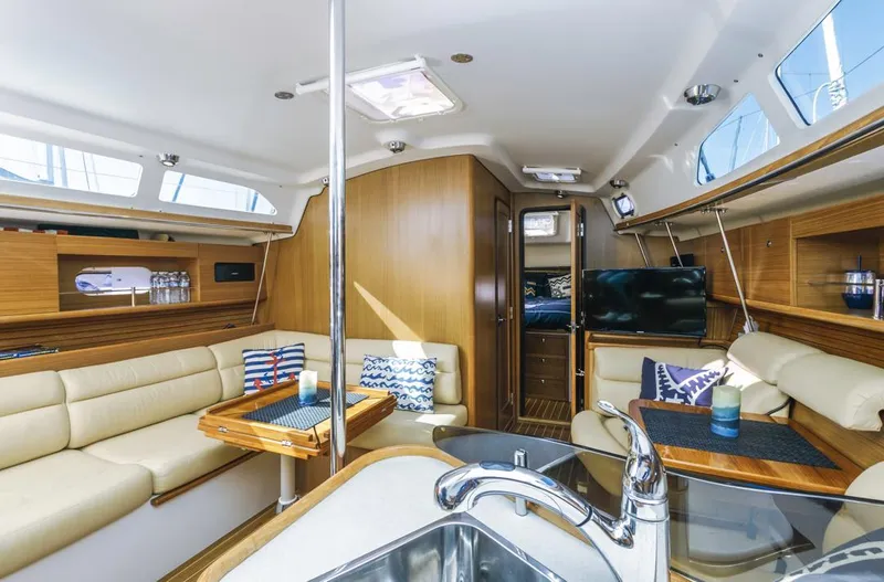 Kia Ora Yacht Photos Pics Luxurious interior of 2014 Catalina 385 sailboat with modern amenities and comfortable seating.