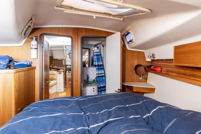 Kia Ora Yacht Photos Pics Interior of 2014 Catalina 385 sailboat with cozy cabin and wooden furnishings.