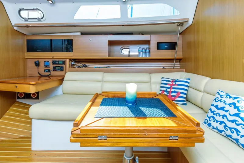 Kia Ora Yacht Photos Pics Interior of 2014 Catalina 385 sailboat with cozy seating and nautical decor.