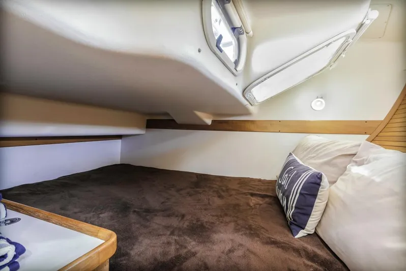 Kia Ora Yacht Photos Pics Cozy cabin interior of 2014 Catalina 385 sailboat with plush bedding.