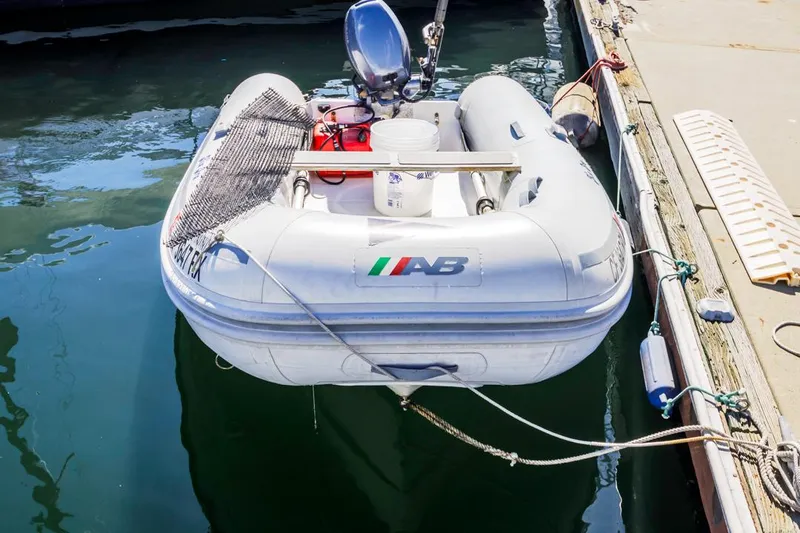 Kia Ora Yacht Photos Pics Inflatable dinghy with motor docked at marina, Catalina 385, 2014 model.