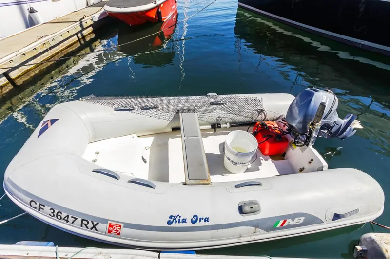 Kia Ora Yacht Photos Pics Inflatable dinghy with outboard motor docked at marina, Catalina 385, 2014 model.