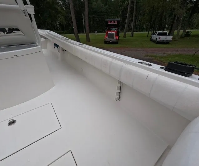  Yacht Photos Pics 2013 Regulator 34 Center Console boat interior, featuring spacious deck and storage compartments.