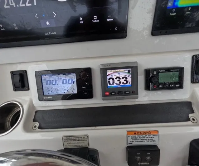  Yacht Photos Pics Dashboard of a 2013 Regulator 34 Center Console with Yamaha and Garmin displays.