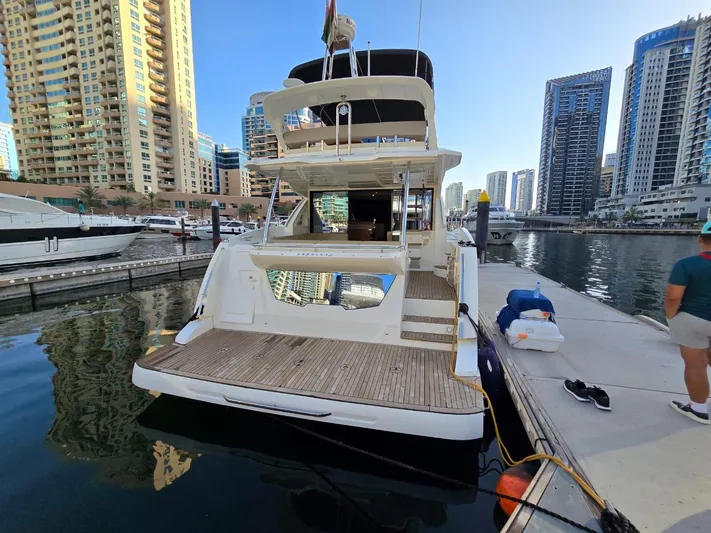  Yacht Photos Pics Luxury Absolute 56 FLY yacht docked in a modern marina, 2015 model.
