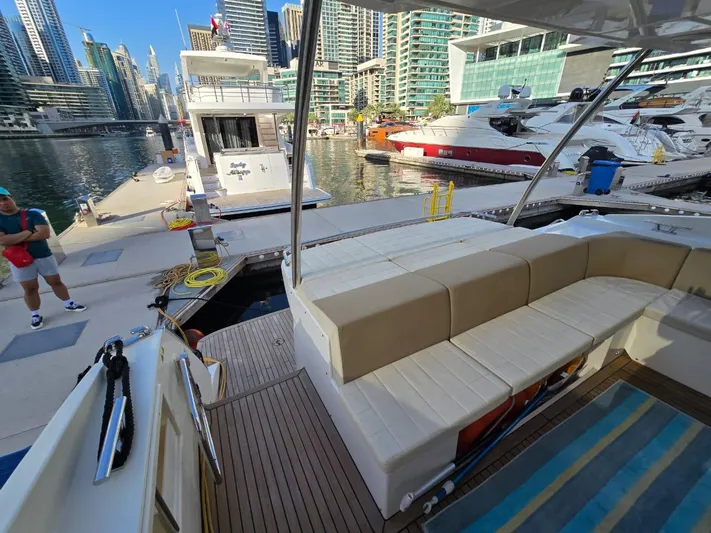  Yacht Photos Pics Luxury Absolute 56 FLY yacht docked at marina, featuring spacious seating area, 2015 model.