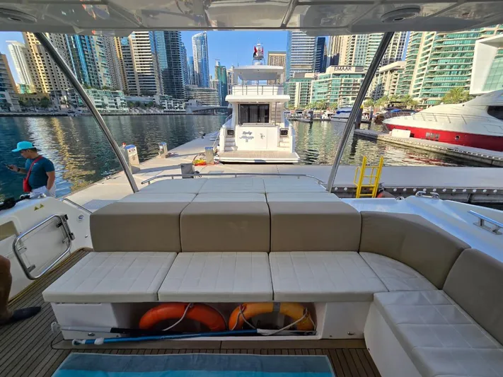  Yacht Photos Pics Luxury yacht Absolute 56 FLY, 2015 model, docked in a marina with cityscape background.