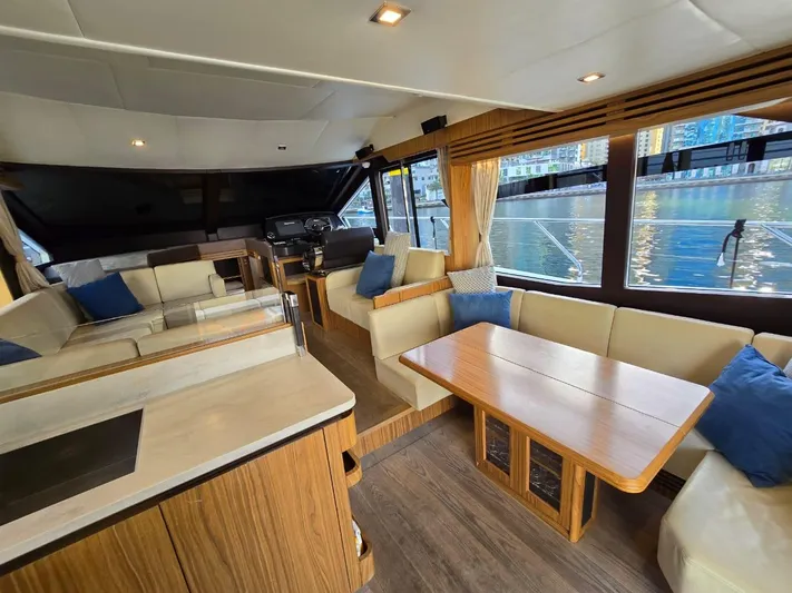  Yacht Photos Pics Luxurious interior of 2015 Absolute 56 FLY yacht with elegant seating and waterfront view.