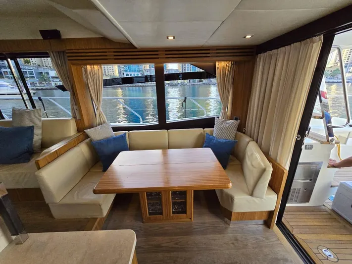  Yacht Photos Pics Luxurious interior of 2015 Absolute 56 FLY yacht with elegant seating and waterfront view.