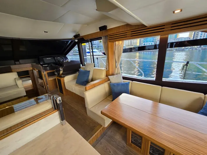  Yacht Photos Pics Luxurious interior of 2015 Absolute 56 FLY yacht with elegant seating and waterfront view.