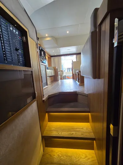 Yacht Photos Pics Interior view of 2015 Absolute 56 FLY yacht with wooden stairs and modern design.