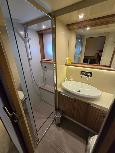  Yacht Photos Pics Luxurious bathroom in 2015 Absolute 56 FLY yacht with modern fixtures and glass shower.