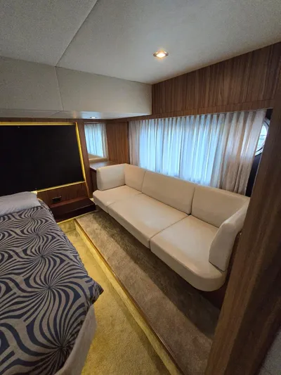  Yacht Photos Pics Luxurious interior of a 2015 Absolute 56 FLY yacht with elegant seating and modern decor.